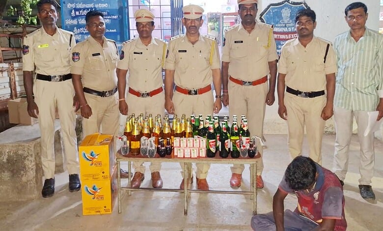 Police officers displaying seized alcohol bottles and cash at a public event.