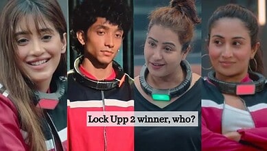 Four contestants in Lock Upp 2 wearing black and pink outfits, smiling and looking at the camera.