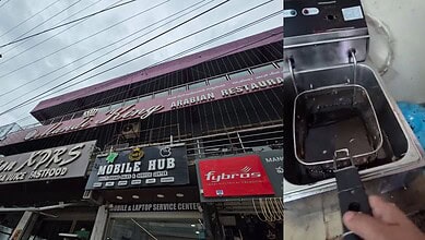 Gachibowli Mandi King restaurant building with signage and a deep fryer in the foreground.