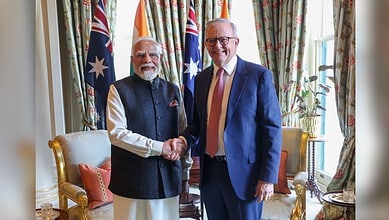Indian Prime Minister Narendra Modi shaking hands with Australian Prime Minister Anthony Albanese in a U.