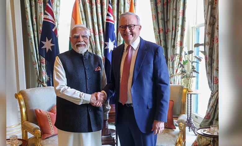 Indian Prime Minister Narendra Modi shaking hands with Australian Prime Minister Anthony Albanese in a U.