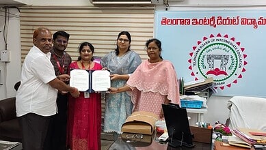 Group of officials and women holding documents at an official event in Hyderabad.