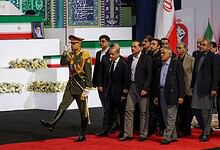 Pakistani officials and military personnel pay tribute during a formal ceremony in Tehran.