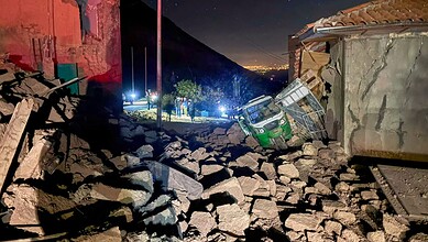 A motor tricycle is stuck amid the debris of homes that collapsed after an earthquake struck Pumpuya, Peru, Sunday, July 19, 2026. AP/PTI