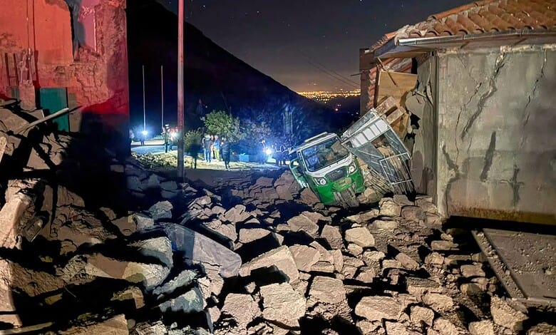 A motor tricycle is stuck amid the debris of homes that collapsed after an earthquake struck Pumpuya, Peru, Sunday, July 19, 2026. AP/PTI