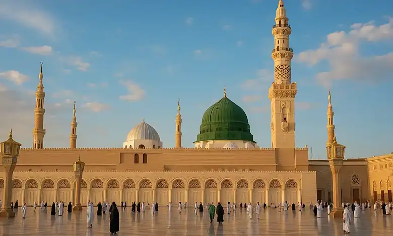View of the Prophet's Mosque in Madinah with the Green Dome and worshippers in the courtyard.