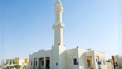 Qatar's first smart mosque powered by solar energy with a tall minaret and modern design.