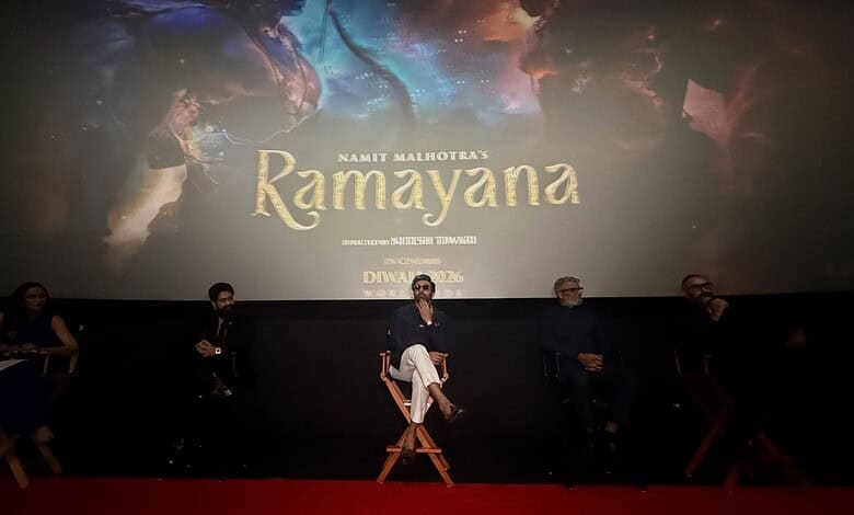Panel discussion at Ramayana movie event with five speakers on stage.