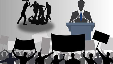 Silhouettes of protesters and a speaker at a rally, highlighting political unrest and public discourse.
