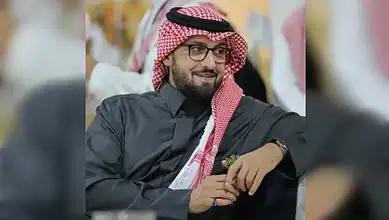Saudi prince wearing traditional attire and glasses at a formal event in London.