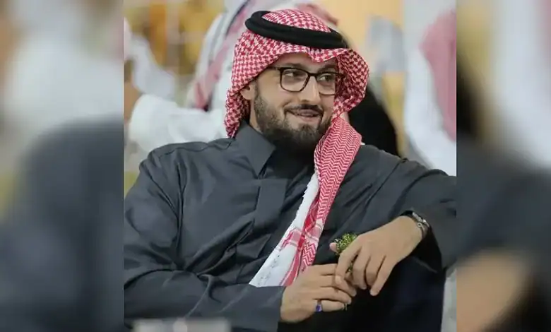 Saudi prince wearing traditional attire and glasses at a formal event in London.
