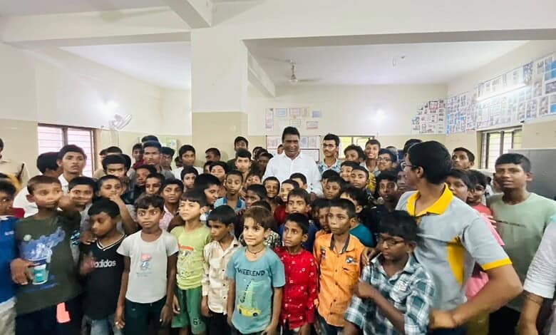 Group of children and teachers in a classroom during an educational event.
