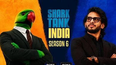 Shark Tank India Season 6 promotional image with a person in a parrot mask and a man in glasses.