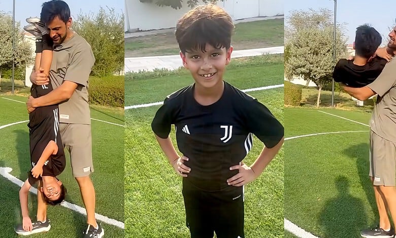 Shoaib Malik with his son Izhaan Mirza Malik in a park setting.