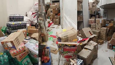 Cluttered storage area with boxes, bottles, and scattered items at Reliance Smart Bazaar, Hyderabad.Expired food, pests found at Reliance Smart Bazaar in Hyderabad