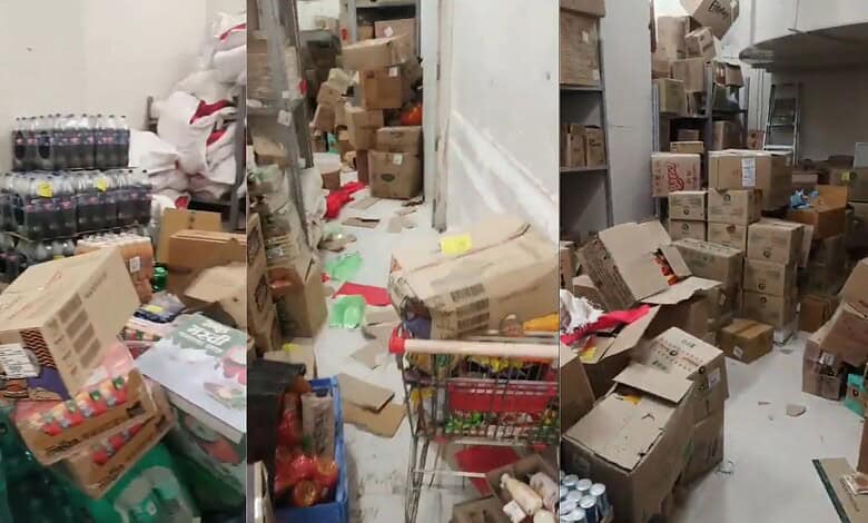 Cluttered storage area with boxes, bottles, and scattered items at Reliance Smart Bazaar, Hyderabad.Expired food, pests found at Reliance Smart Bazaar in Hyderabad