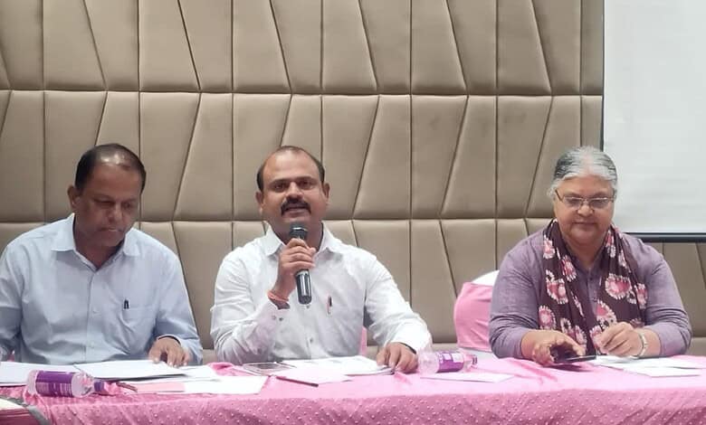 Panel discussion at workshop on safer migration of Indians to Saudi Arabia with speakers at a table.