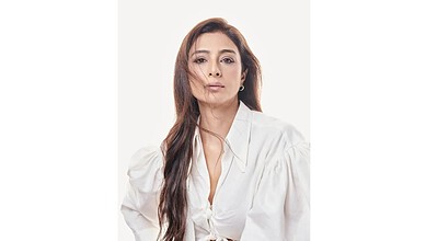 Portrait of Tabassum Fatima Hashmi, known as Tabu, with a confident expression and flowing hair.