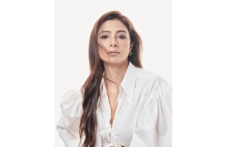 Portrait of Tabassum Fatima Hashmi, known as Tabu, with a confident expression and flowing hair.