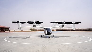 UAE's first commercial air taxi vertiport with a drone-like aircraft on the helipad.