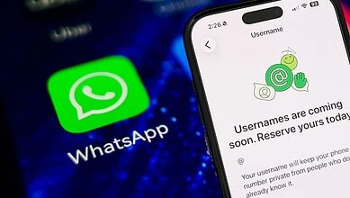 Smartphone screen showing WhatsApp message about upcoming username feature.