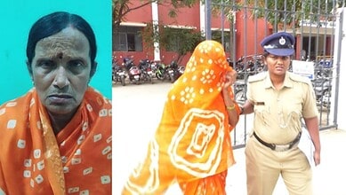 Woman in orange saree being escorted by police officer outside a building in Karnataka.