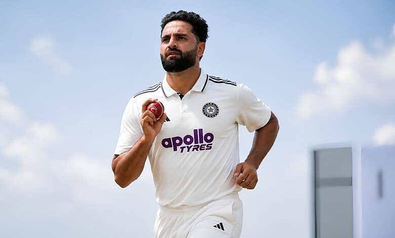 J-K fast bowler Auqib Nabi holding a cricket ball on the field.