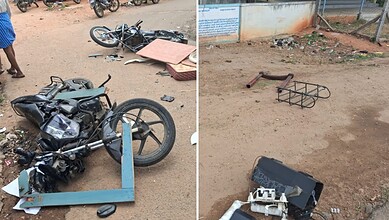 Damaged motorcycle and bicycle lying on the ground after an accident in Karnataka.