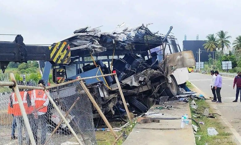 Wreckage of a bus involved in a crash on Bengaluru-Mysuru Expressway, with debris scattered.