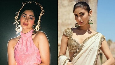 Two women in traditional Indian attire, one in pink and the other in cream with gold embellishments.