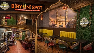 Interior of Biryani Spot Toronto with vibrant decor and seating area for dining.