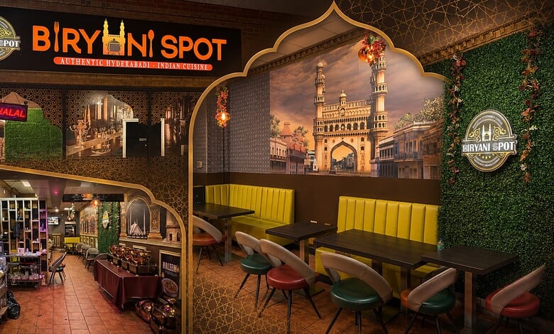 Interior of Biryani Spot Toronto with vibrant decor and seating area for dining.