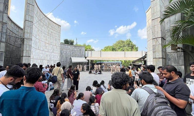 Students gather outside the EFLU campus after the clash.