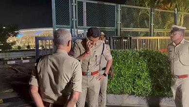Police officers at Bengaluru airport's Taj hotel investigating a tragic incident.