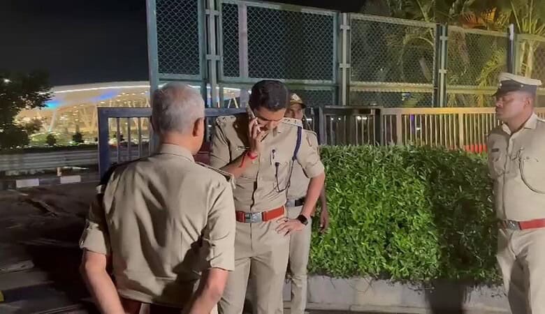 Police officers at Bengaluru airport's Taj hotel investigating a tragic incident.