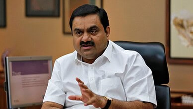 Adani speaking in an office setting, emphasizing his faith in the rule of law amid legal challenges.