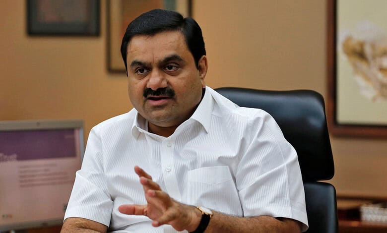 Adani speaking in an office setting, emphasizing his faith in the rule of law amid legal challenges.