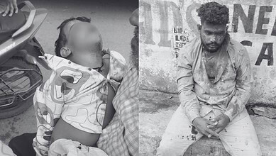 Man sitting on the ground with a young girl, both appear distressed, in an urban setting.