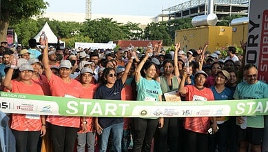 Large group of runners at the start line of the Cyberabad 5K Run event.