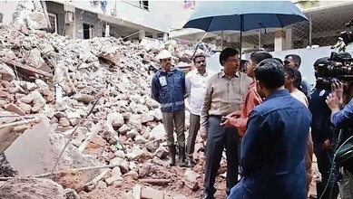 Officials inspect rubble after building collapse in Anjaiah Nagar, Hyderabad.