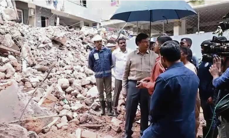 Officials inspect rubble after building collapse in Anjaiah Nagar, Hyderabad.