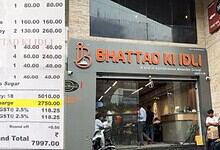 Bhattad Ki Idli restaurant entrance with customers and staff outside in Hyderabad.