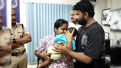 Police and family members reunite with abducted baby in Hyderabad.
