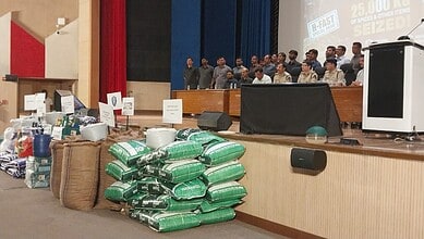 Police display seized items and suspects during a crackdown event at H-Fast team.