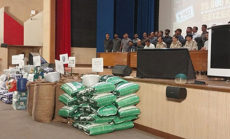 Police display seized items and suspects during a crackdown event at H-Fast team.