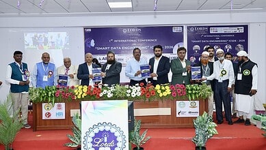 Group of professionals at Hyderabad LIET conference on smart data engineering, holding certificates.