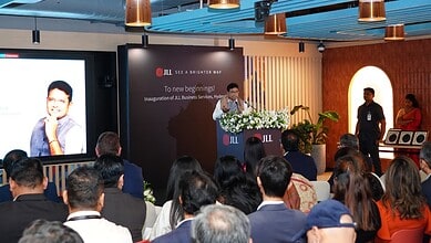 JLL Hyderabad launch event with speaker addressing audience at the inauguration.