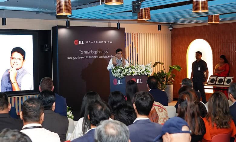 JLL Hyderabad launch event with speaker addressing audience at the inauguration.
