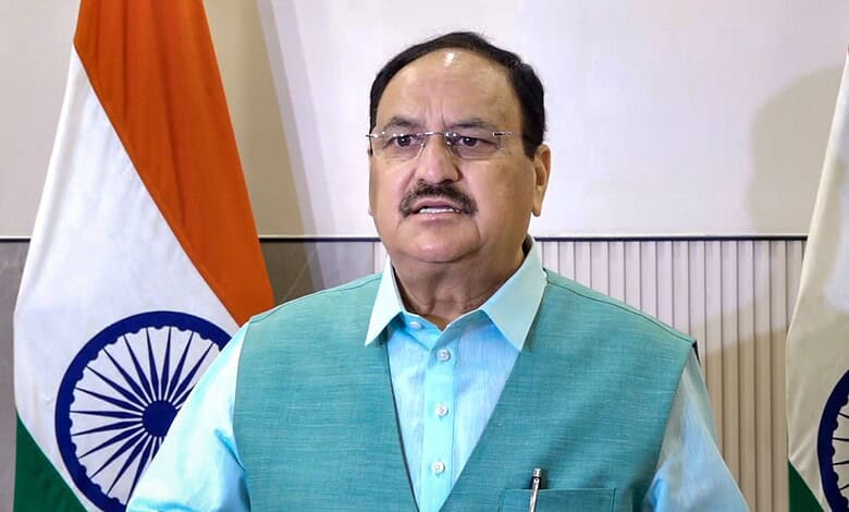 Nadda meets reservation protestors with Indian flags in the background.