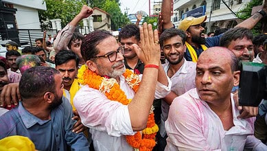 Jan Suraaj Party founder and candidate Prashant Kishor greets people during a march as he leads over BJP's Neeraj Kumar Sinha in the Bankipur bypoll
